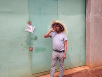 Tesfaya Bekele outside warehouse Ethiopia Guji Coffee Suke Quto